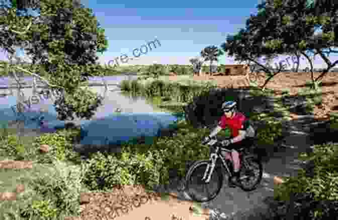 A Cyclist Riding Along A Serene Lakeside Trail In The Lake District Cycling In The Lake District: Week Long Tours And Day Rides (Cicerone Cycling Guides)