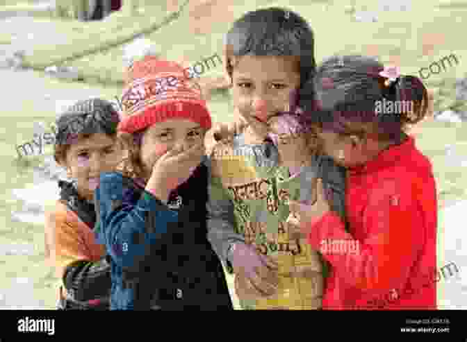 A Group Of Afghan Children Playing In A Field. There And Back: Photographs From The Edge