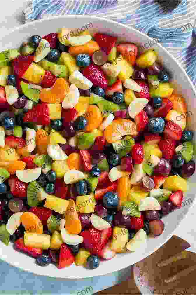 A Vibrant And Refreshing Rainbow Salad Featuring A Variety Of Colorful Fruits And Vegetables, Such As Strawberries, Blueberries, Raspberries, Carrots, Bell Peppers, And Cucumbers Running On Veggies: Plant Powered Recipes For Fueling And Feeling Your Best