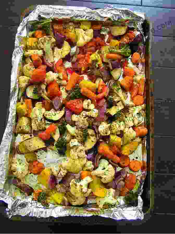 A Vibrant Assortment Of Roasted Vegetables, Including Bell Peppers, Carrots, Onions, And Broccoli, Arranged On A Baking Sheet Running On Veggies: Plant Powered Recipes For Fueling And Feeling Your Best